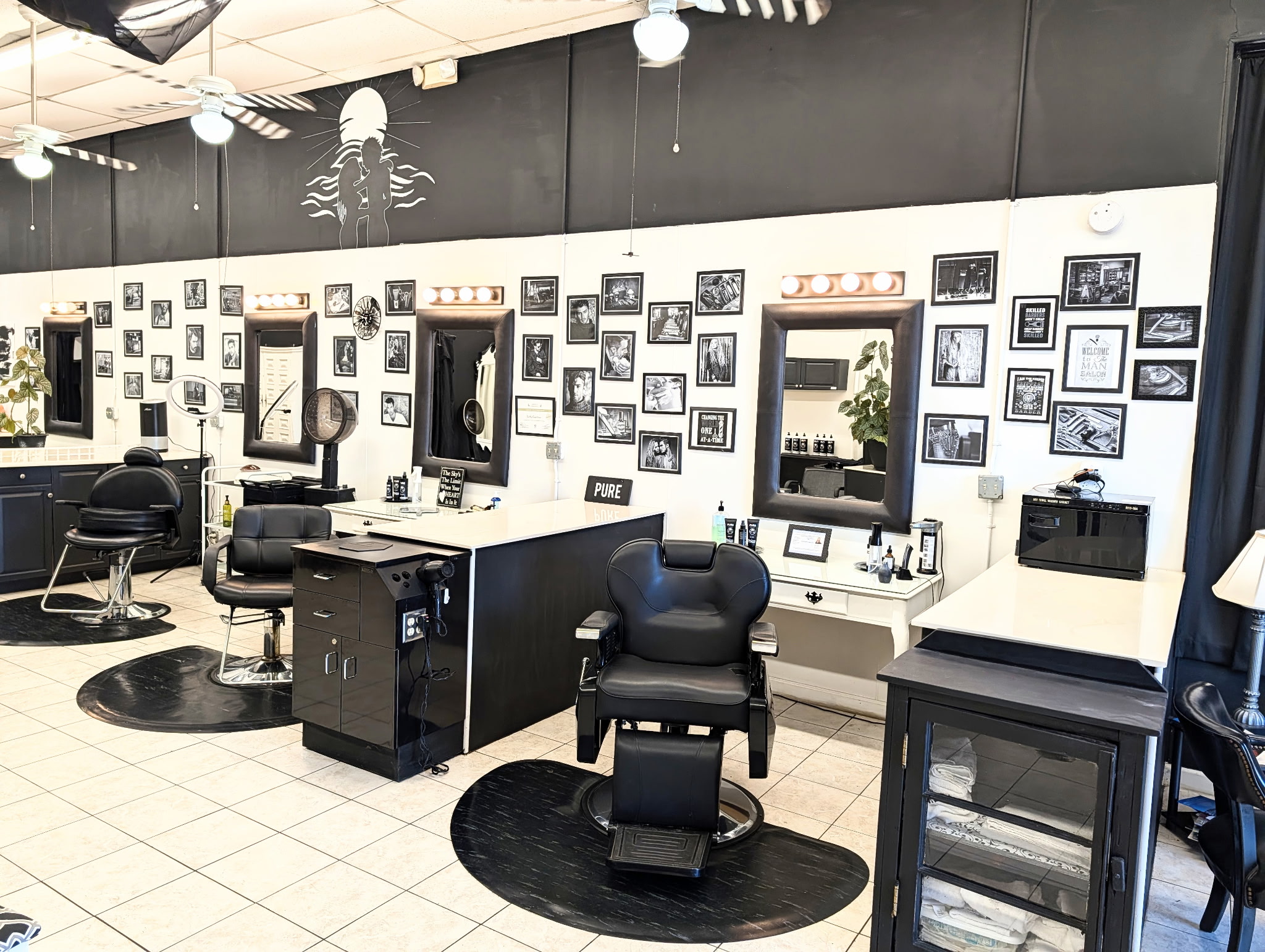 Styling stations and chairs inside PURE Salon & Barbershop